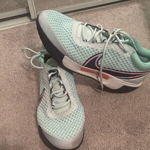 Nike Women's Mint Green Mesh Athletic Sneakers with Black and Pink Accents